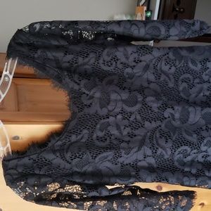 Diane VonFurstenberg black lace dress with zip up the back. Fits more like a 6-